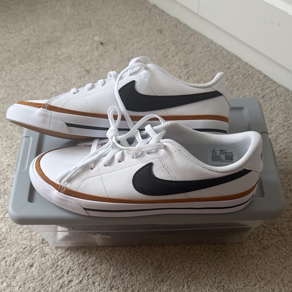 Nike White Low-Top Sneakers with Black Swoosh and Brown Accent